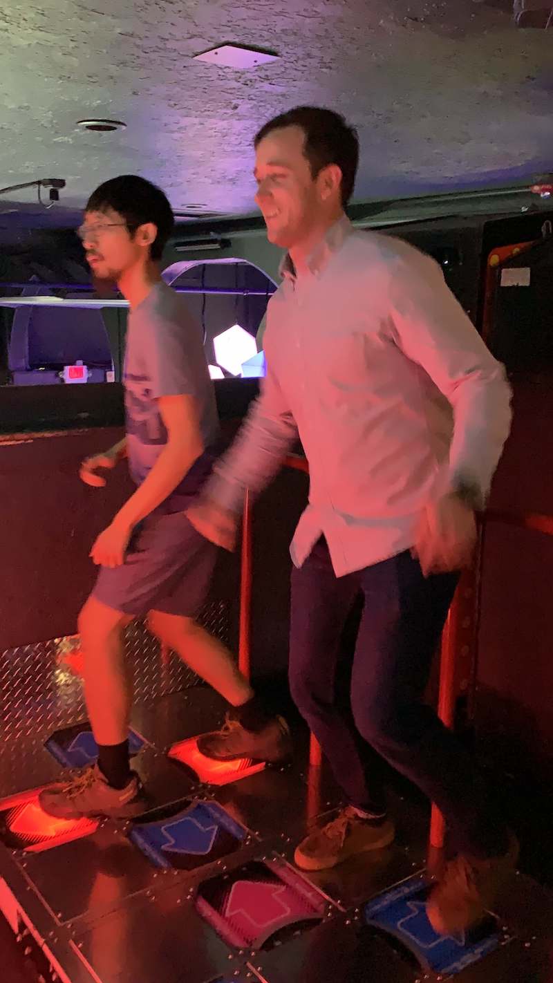 coworkers enjoying a round of DDR